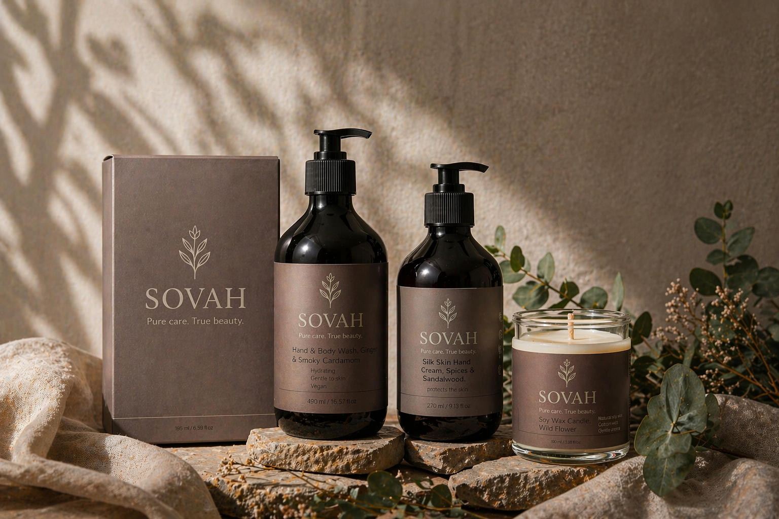 SOVAH skincare and home collection with hand wash, hand cream, soy candle and gift box on natural background